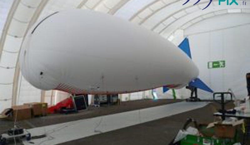 Interior view of a military inflatable hangar, with an aerostat, a dirigible balloon that is stored and protected from wind and weather.