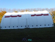 Large mobile military aeronautical hangar, composed of 2 half-moon tunnel modules, to protect against bad weather, wind, rain, snow and dust.