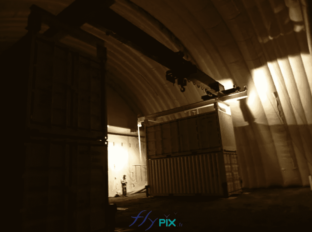 NEXTER: an interior view of the large inflatable military hangar. Positioning of containers inside, installation of infrastructure inside the inflatable military tent. – All rights reserved, copyright FLYPIX.