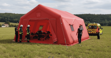 A simulation view showing the deployment of a 37 m² PMA tent, a captive air inflatable structure inflated with an electric pump. Deployment in a rural area. This inflatable shelter has a 0.6 mm single-layer PVC shell for the airtight inflatable tube frames, and a 0.45 mm single-layer PVC shell for the walls and roof. This inflatable tent is easy to set up and deploy, and when folded, it takes up very little space in the intervention vehicle. A removable groundsheet allows for deployment on a clean and dry surface. – This image was AI-generated using GEMINI, based on 3D model views of the final artwork created by our graphic designer and approved by the client, as well as photos and real-life shots of certain details of the inflatable tent, taken directly in our manufacturing workshop. Media partially generated by AI and verified by an agent. – Copyright Vivien LAÏLLE/FlyPix, all rights reserved, reproduction prohibited.