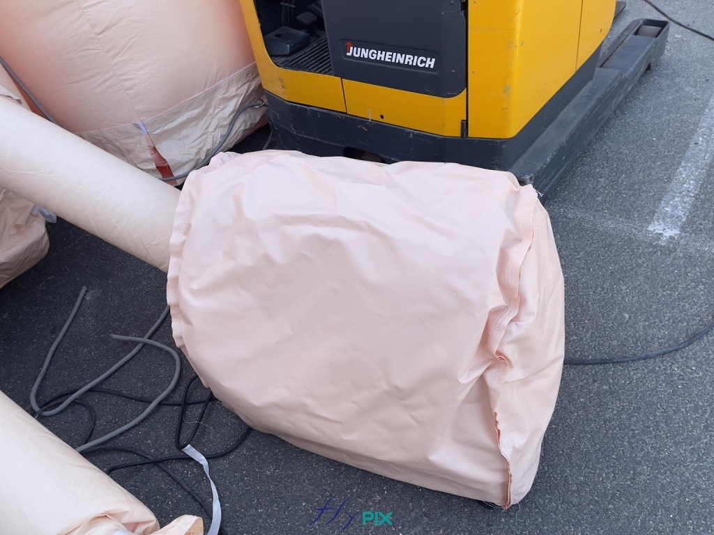 A detailed view of a rainproof enclosure, designed to reduce noise for an electric turbine. This optional accessory is recommended to protect turbines from rain, inclement weather, and dust, and also to improve user comfort by reducing noise from the electric turbines. - Copyright: Vivien LAÏLLE/FLYPIX, all rights reserved. A detailed view of a rainproof enclosure, designed to reduce noise for an electric turbine. This optional accessory is recommended to protect turbines from rain, inclement weather, and dust, and also to improve user comfort by reducing noise from the electric turbines. – Copyright: Vivien LAÏLLE/FLYPIX, all rights reserved.